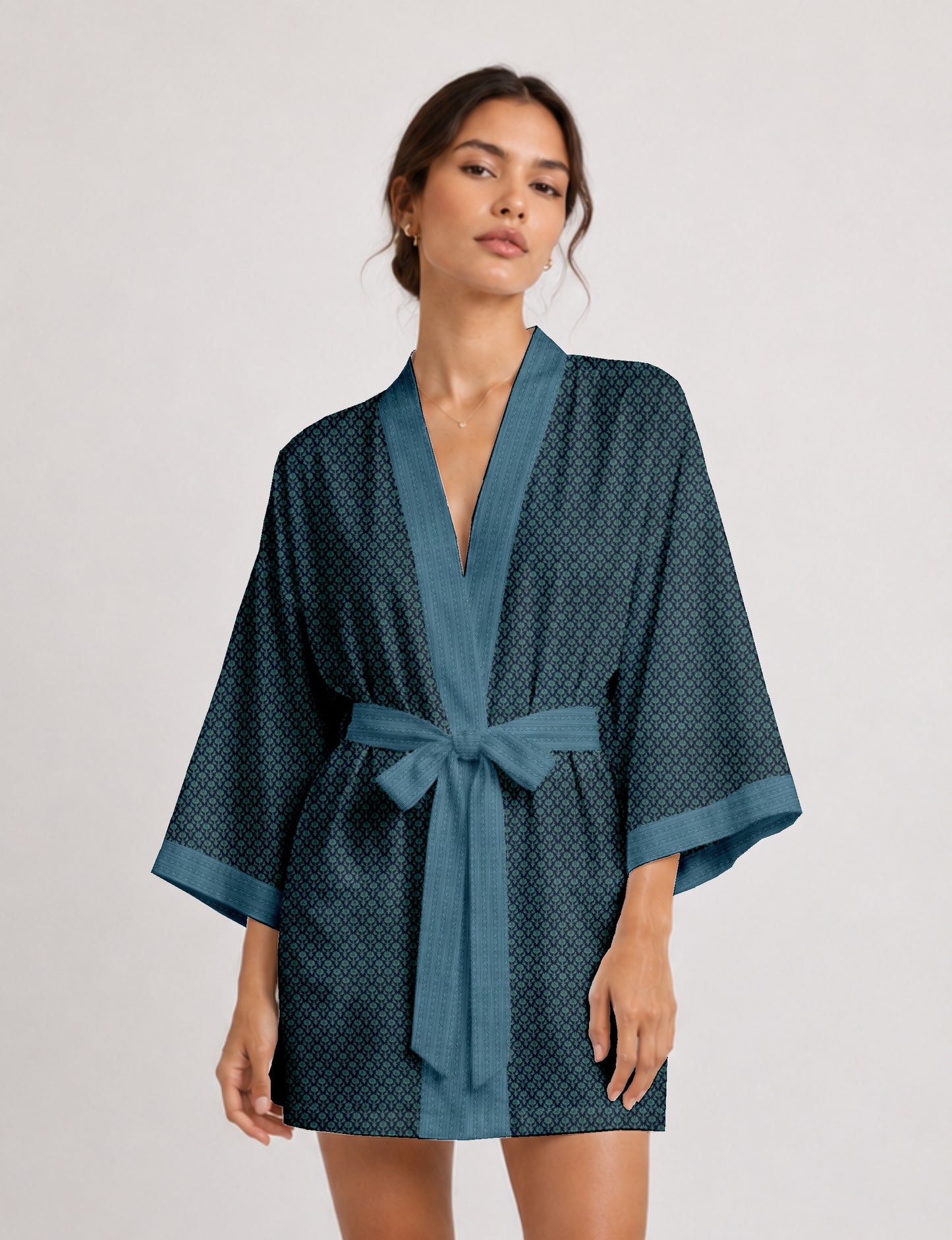 Short kimono robe with wrap front, V-neckline, wide sleeves, waist tie, and concealed skort detail.