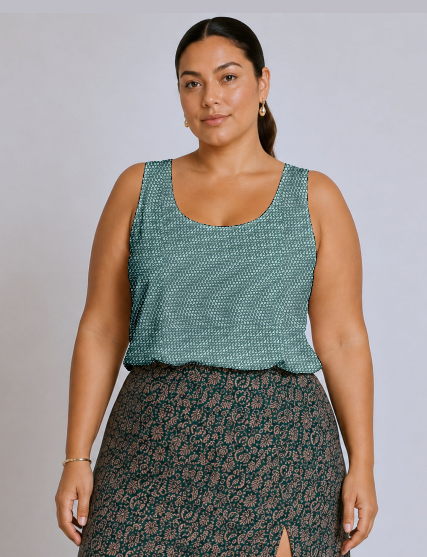 Women's sleeveless blouse with a relaxed straight fit, wide scoop neckline, deep scoop back, and hip-length silhouette.
