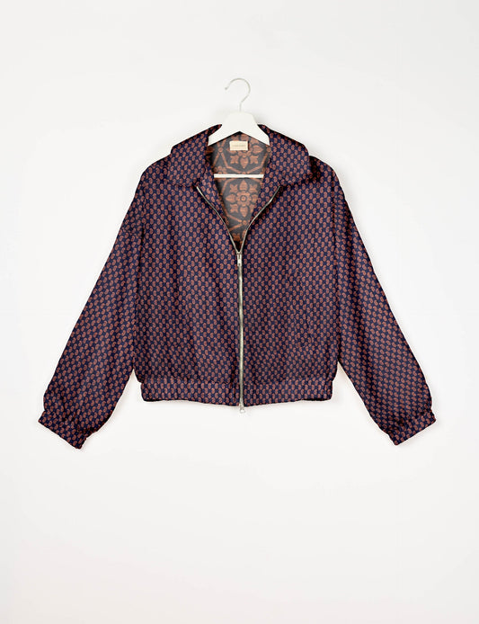 Upcycled Bomber Jacket made from recycled sari materials, featuring a cute cropped shape, elasticated hem and cuffs, and contrast sari print lining. Sustainable apparel promoting eco-friendly fashion and ethical clothing.