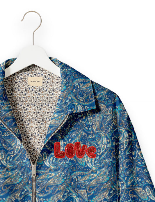 Love Bomber Jacket made from recycled fabric, featuring hand-stitched Aari embroidery. A unique piece of zero-waste clothing, part of the circular fashion movement. Designed with upcycled materials for a stylish yet environmentally friendly clothing choice.