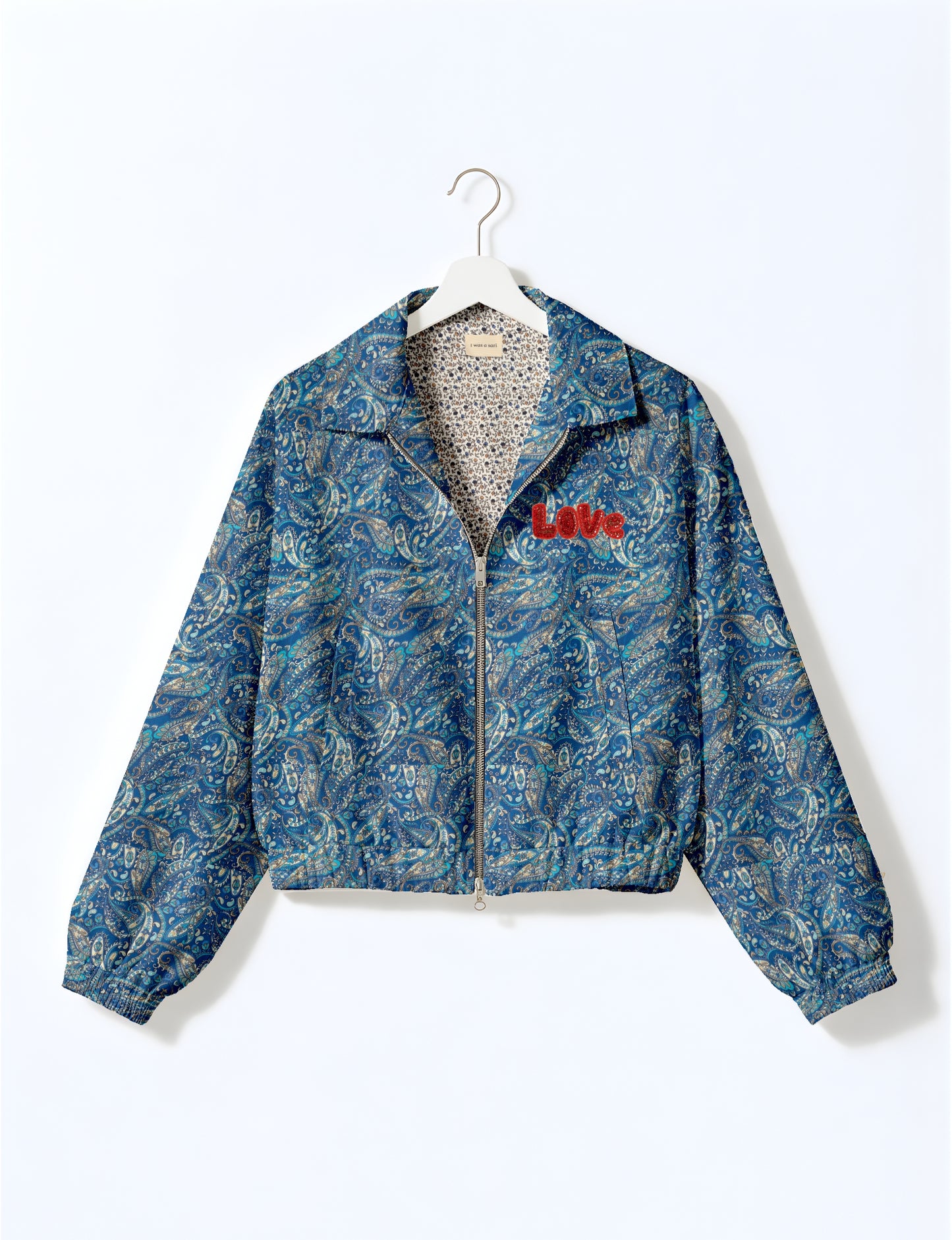 Love Bomber Jacket made from recycled fabric, featuring hand-stitched Aari embroidery. A unique piece of zero-waste clothing, part of the circular fashion movement. Designed with upcycled materials for a stylish yet environmentally friendly clothing choice.