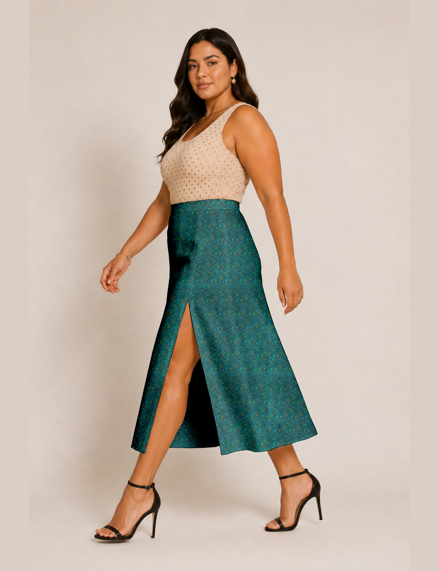 Woman wearing a yellow and black micro patterned A-line skirt with front slit, paired with beige sleeveless top and black