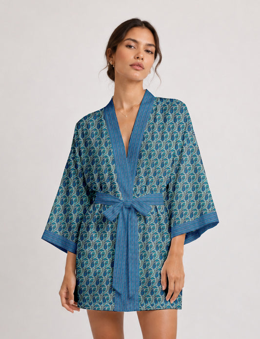 Short kimono robe with wrap front, V-neckline, wide sleeves, waist tie, and concealed skort detail.
