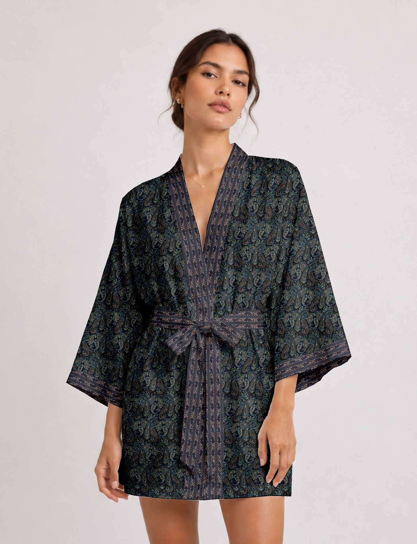 Short kimono robe with wrap front, V-neckline, wide sleeves, waist tie, and concealed skort detail.