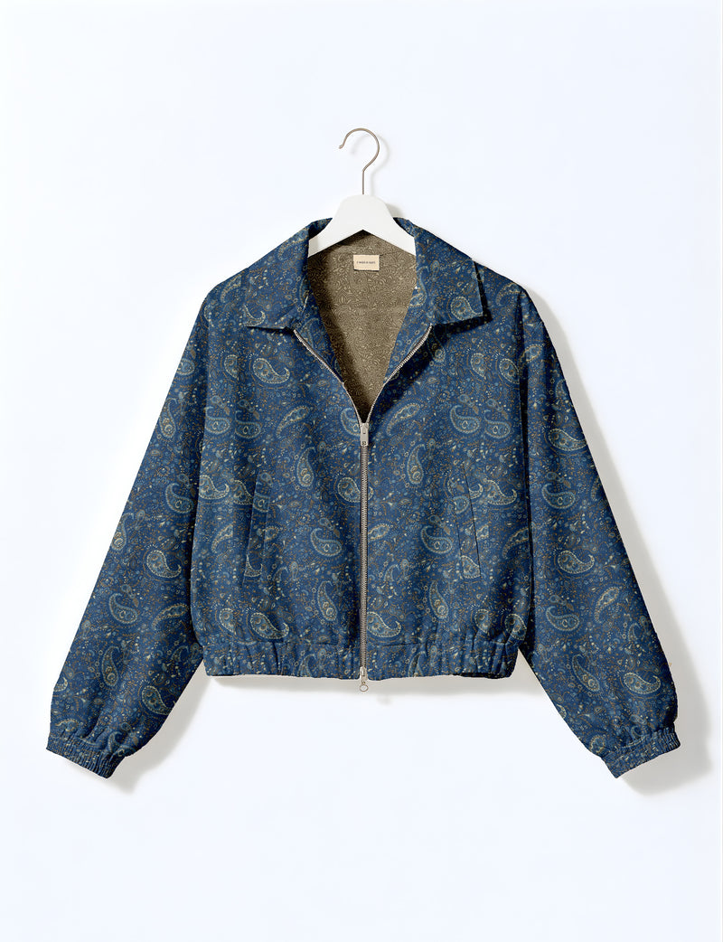 Woman wearing a yellow floral bomber jacket with front zipper, elastic cuffs, and side pockets, shown from front view