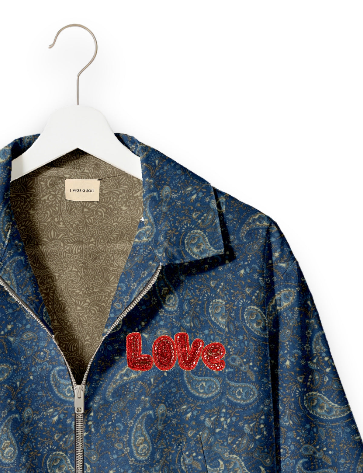 Love Bomber Jacket made from recycled fabric, featuring hand-stitched Aari embroidery. A unique piece of zero-waste clothing, part of the circular fashion movement. Designed with upcycled materials for a stylish yet environmentally friendly clothing choice.