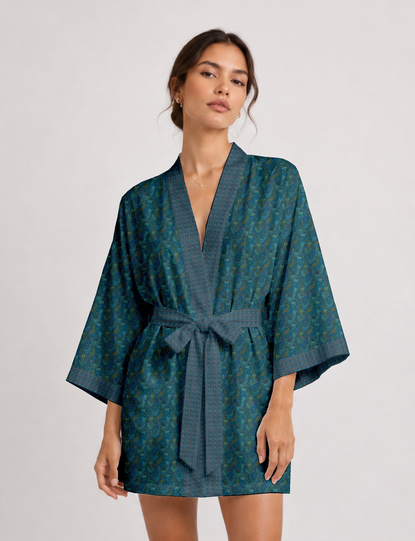 Short kimono robe with wrap front, V-neckline, wide sleeves, waist tie, and concealed skort detail.