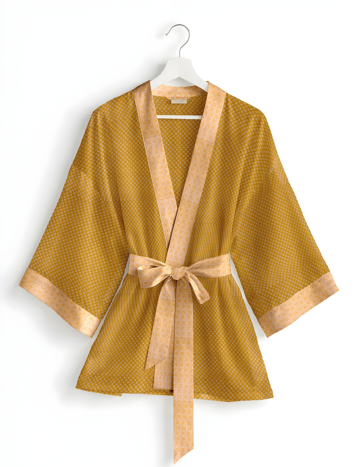 Short kimono robe with wrap front, V-neckline, wide sleeves, waist tie, and concealed skort detail.