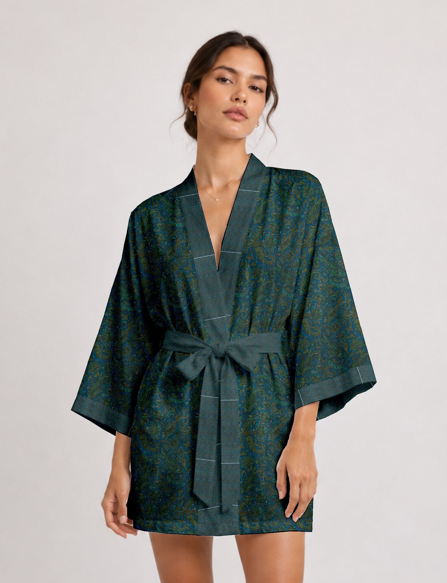 Short kimono robe with wrap front, V-neckline, wide sleeves, waist tie, and concealed skort detail.