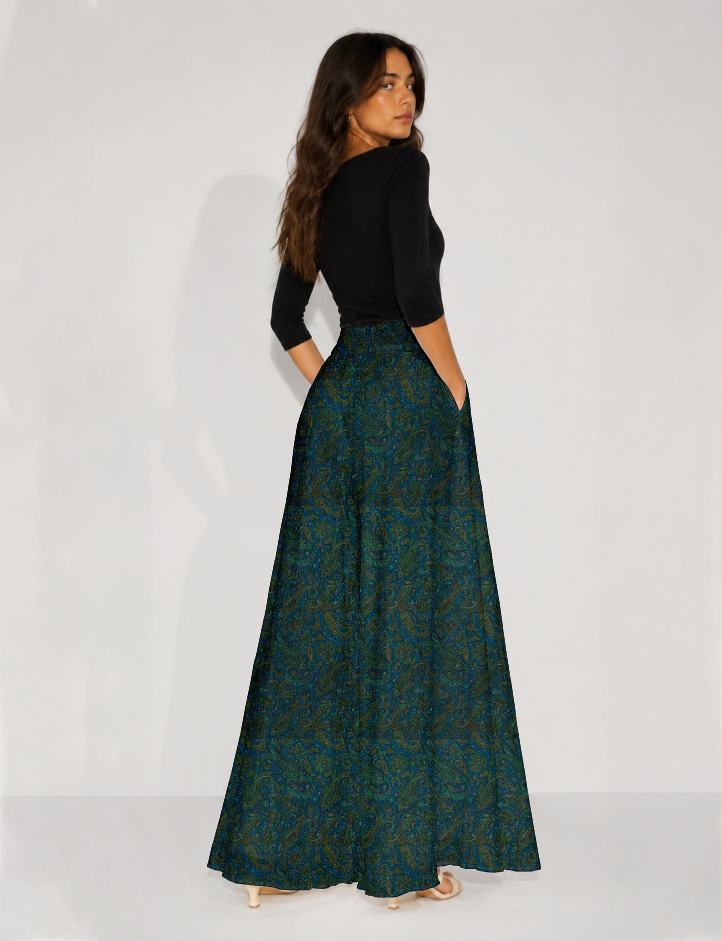 Blue wide leg palazzo trousers with a small tropical floral pattern, flat lay front view