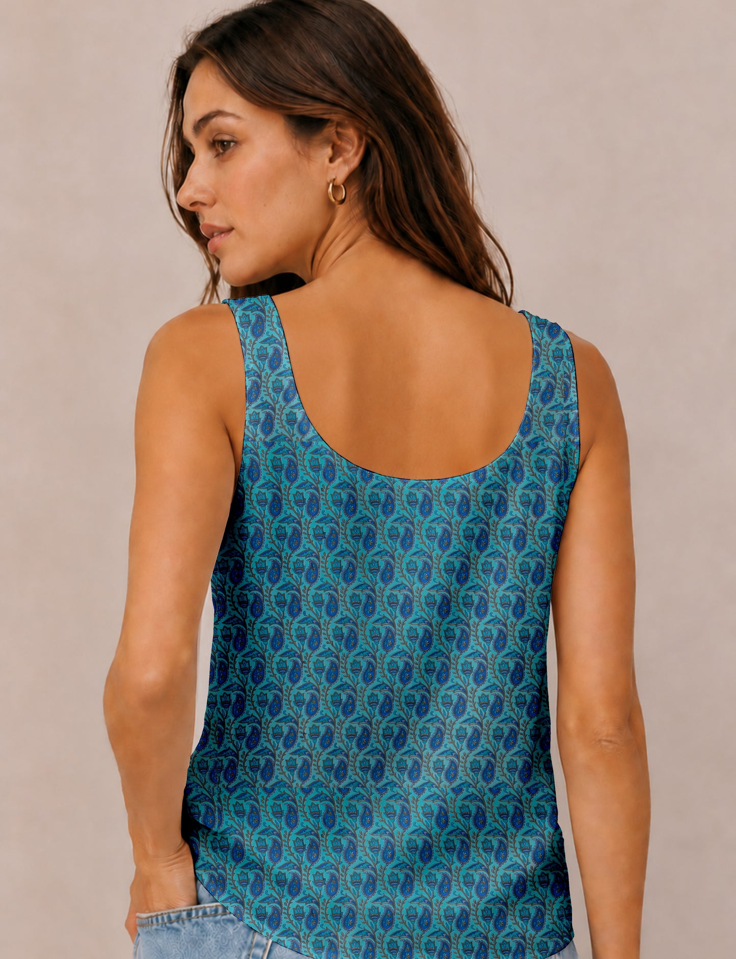 Women's sleeveless blouse with a relaxed straight fit, wide scoop neckline, deep scoop back, and hip-length silhouette.