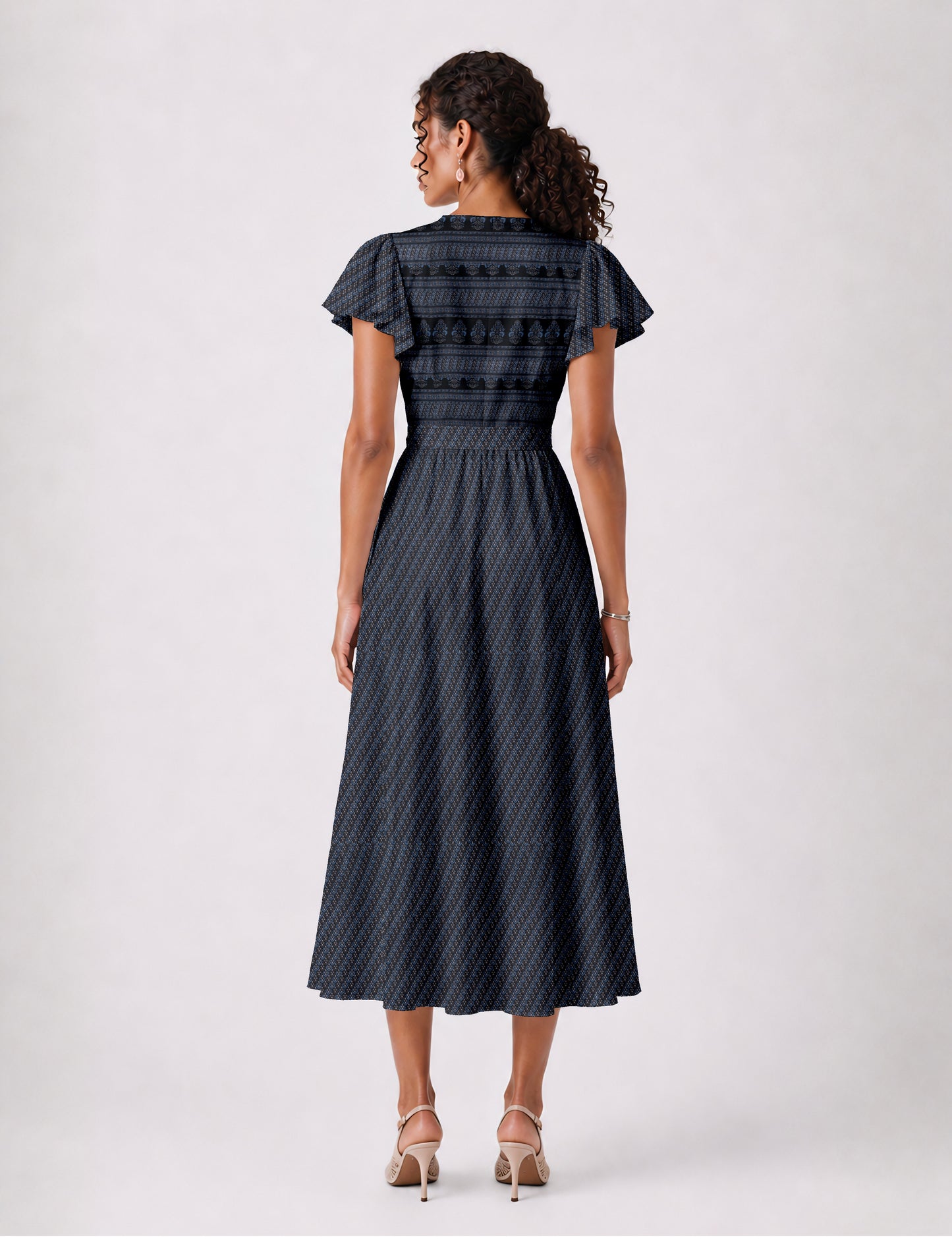 Midi wrap dress with V-neckline, fitted bodice, tie waist, and flared mid-calf skirt
