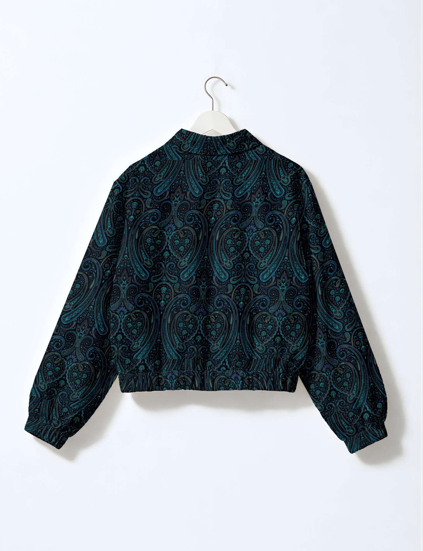Women's cropped bomber jacket with twin metallic front zippers, welt pockets, elasticated hem and cuffs, and contrast sari print lining.