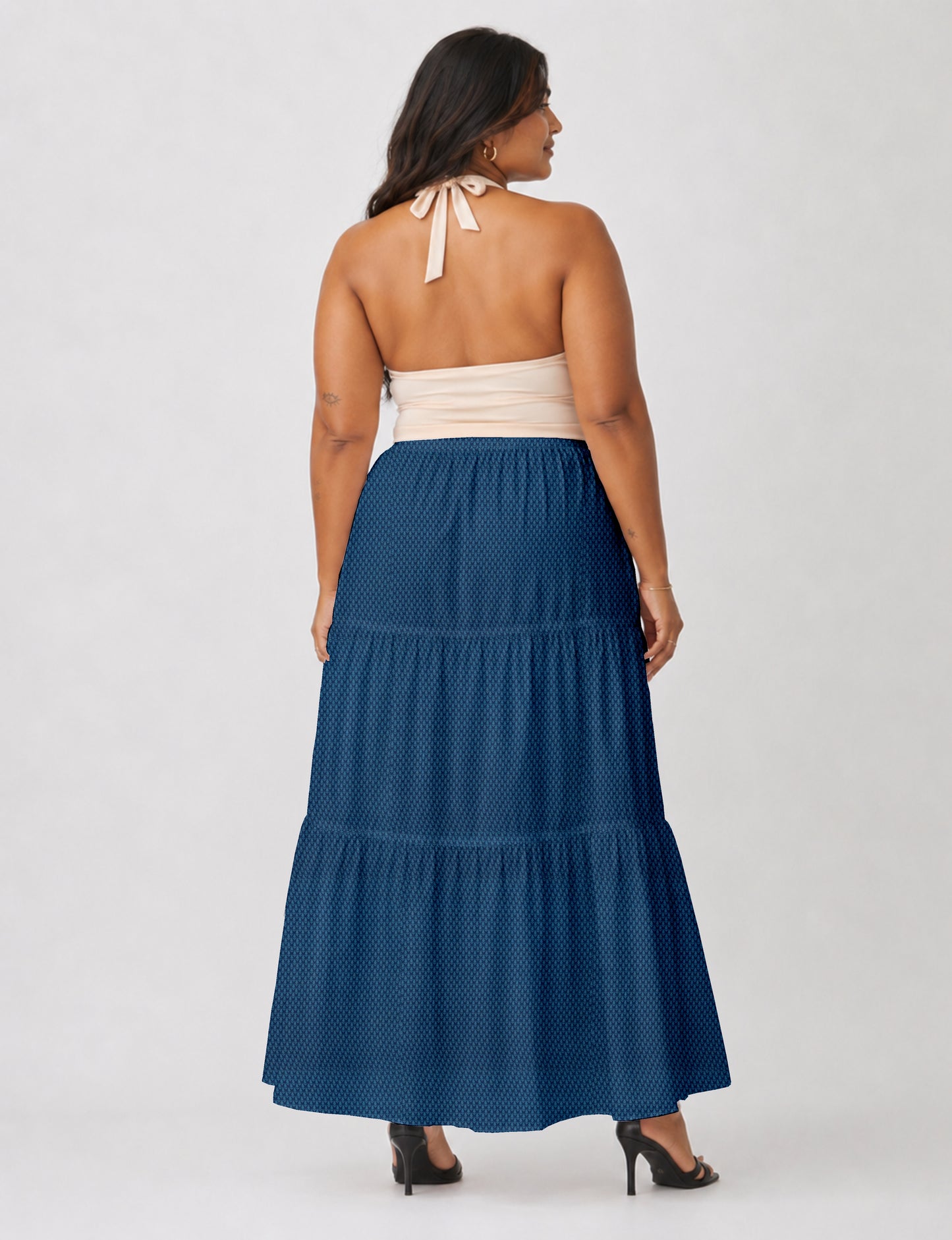 Yellow midi tiered skirt with small dark geometric micro pattern, flat lay front view