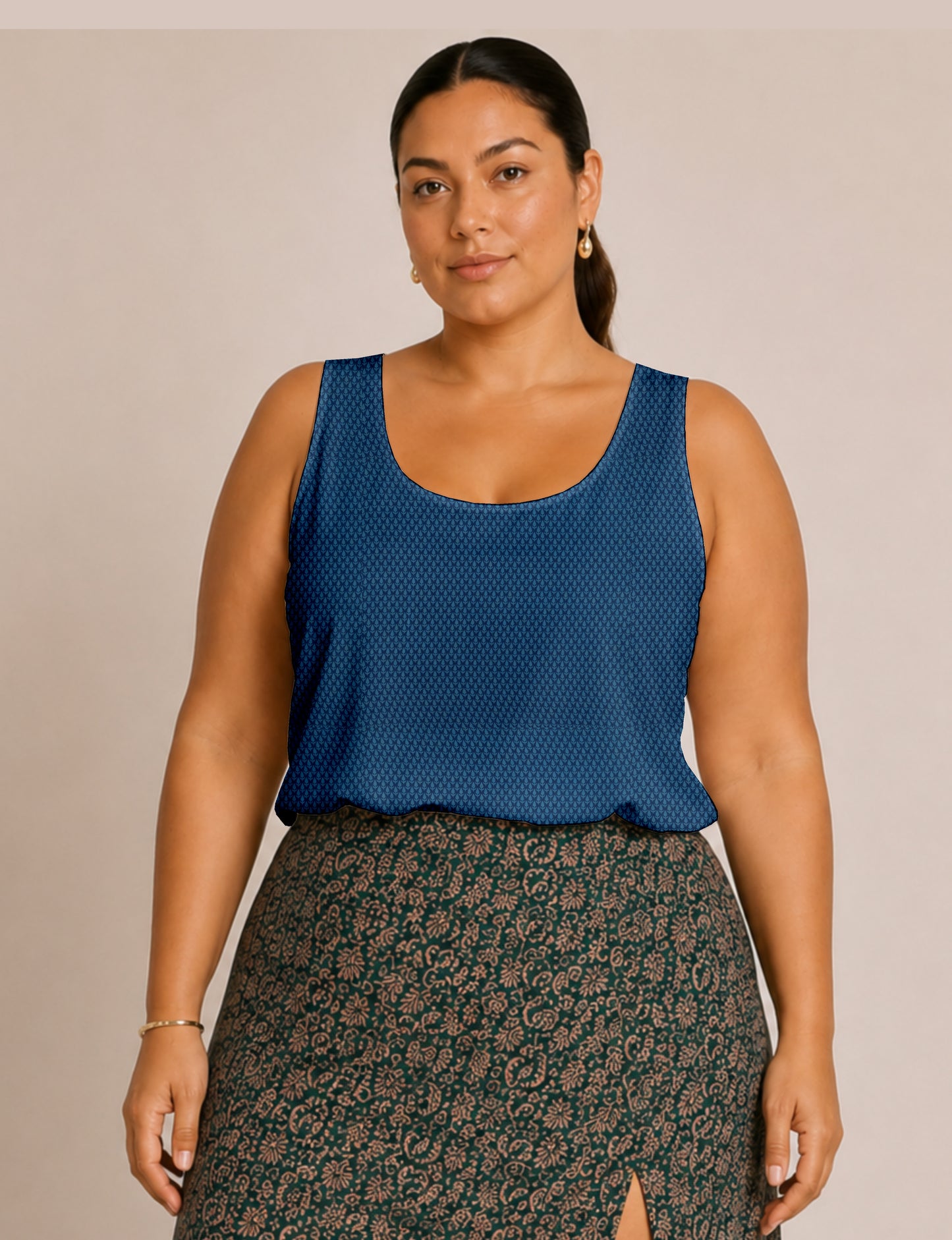 Women's sleeveless blouse with a relaxed straight fit, wide scoop neckline, deep scoop back, and hip-length silhouette.