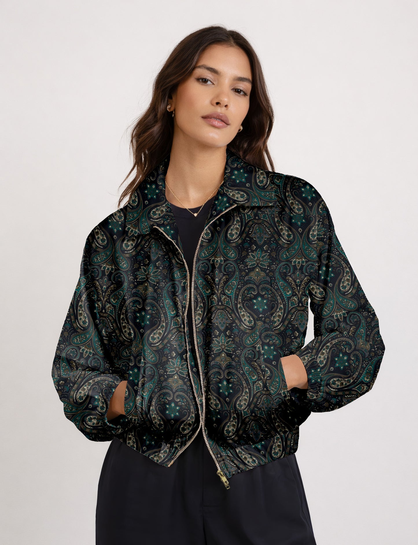Woman wearing a yellow floral bomber jacket with front zipper, elastic cuffs, and side pockets, shown from front view