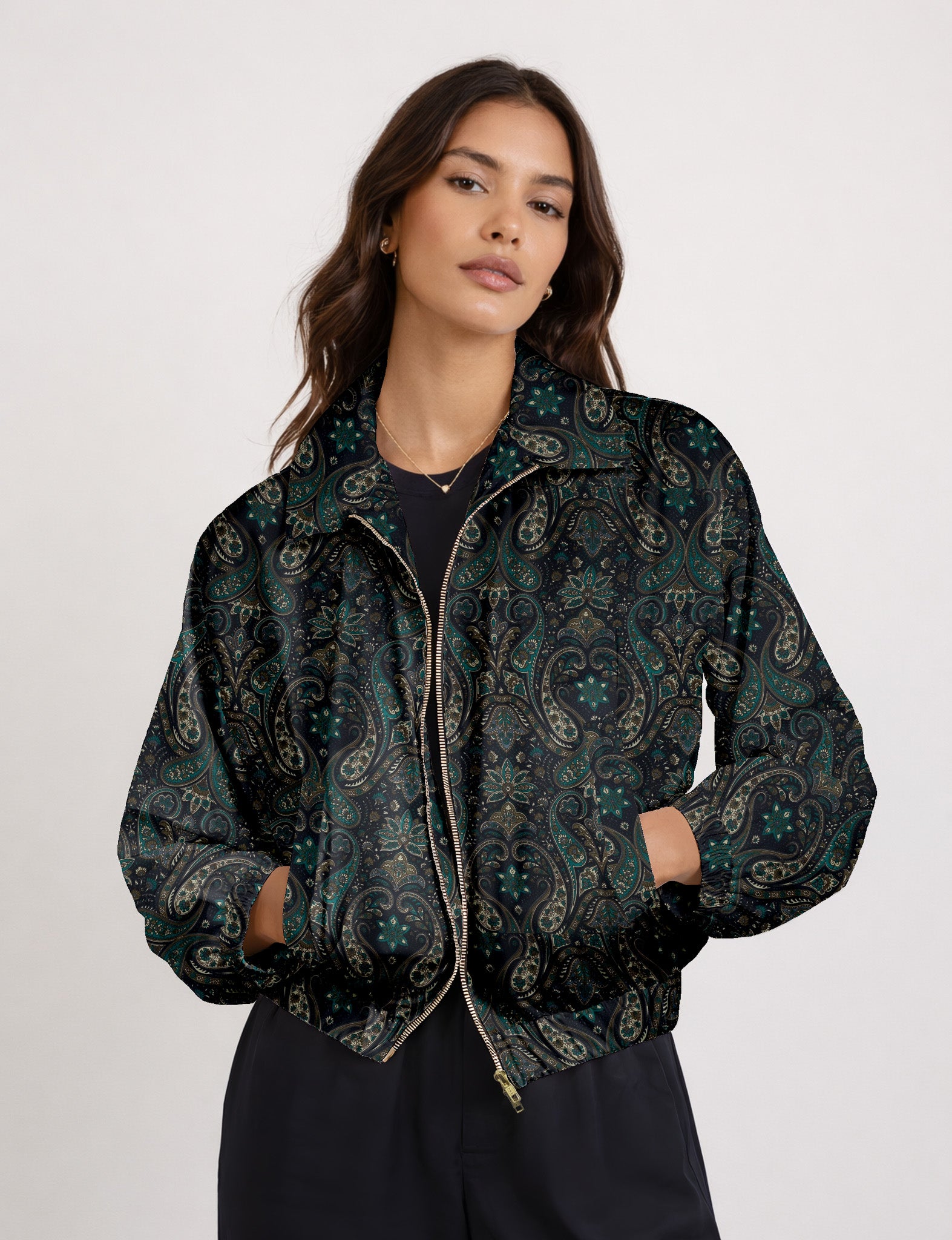 Woman wearing a yellow floral bomber jacket with front zipper, elastic cuffs, and side pockets, shown from front view