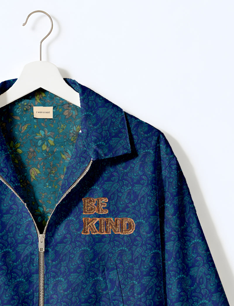 BE KIND Bomber jacket made from upcycled sari fabric with handcrafted Aari embroidery by female artisans.