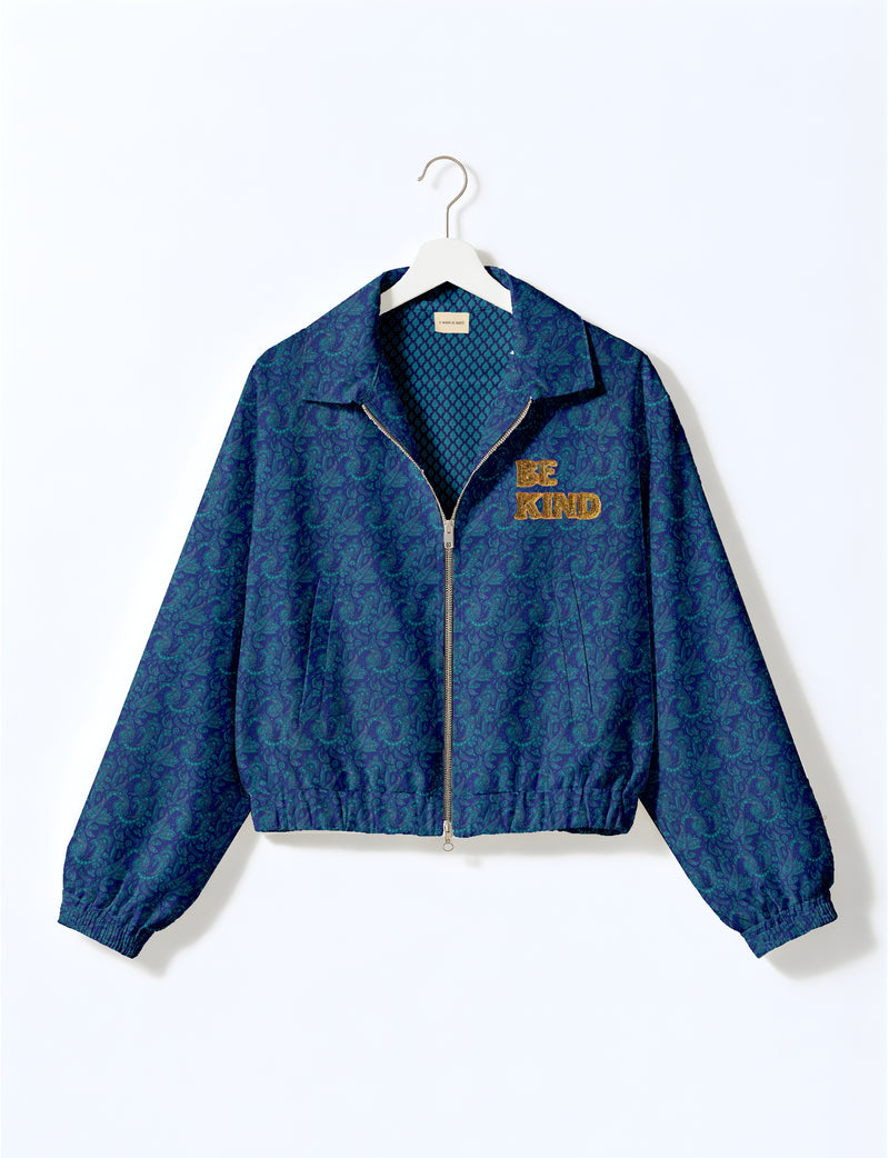 BE KIND Bomber jacket made from upcycled sari fabric with handcrafted Aari embroidery by female artisans.