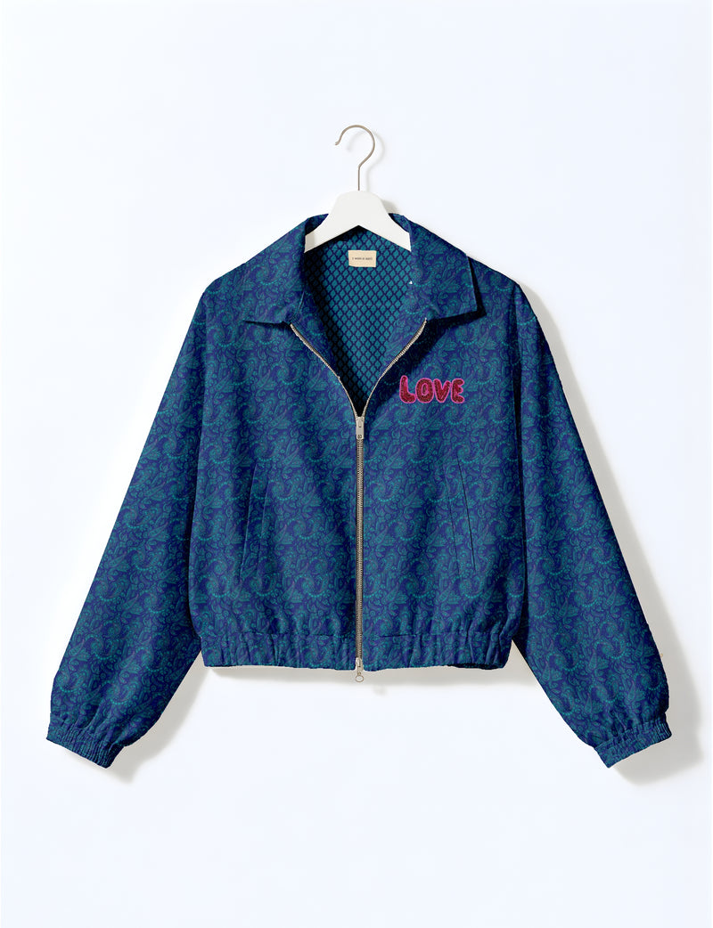Love Bomber Jacket made from recycled fabric, featuring hand-stitched Aari embroidery. A unique piece of zero-waste clothing, part of the circular fashion movement. Designed with upcycled materials for a stylish yet environmentally friendly clothing choice.