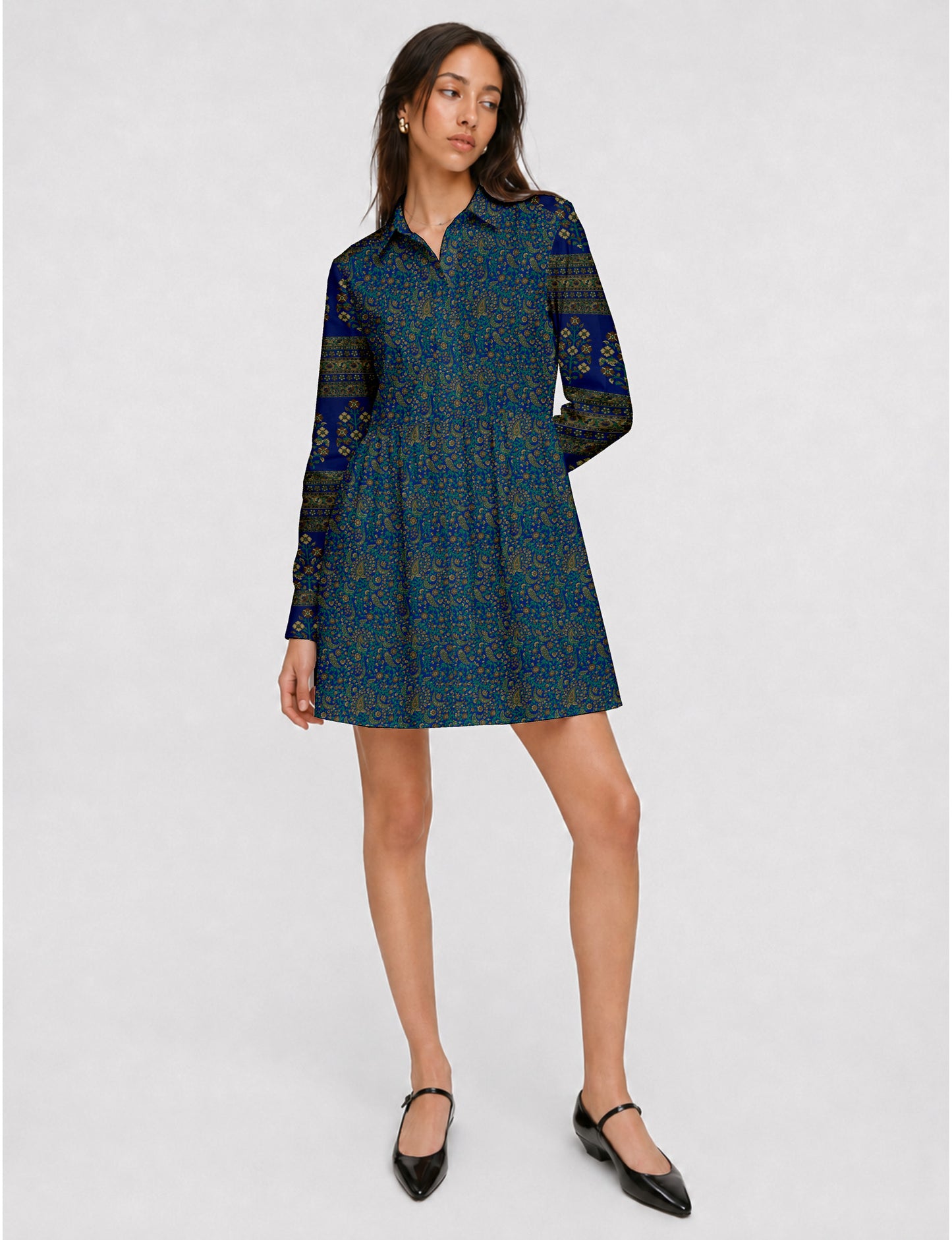 Short shirt dress with a relaxed A-line silhouette, point collar, partial button placket, gathered waist, side pockets, and full-length cuffed sleeves.