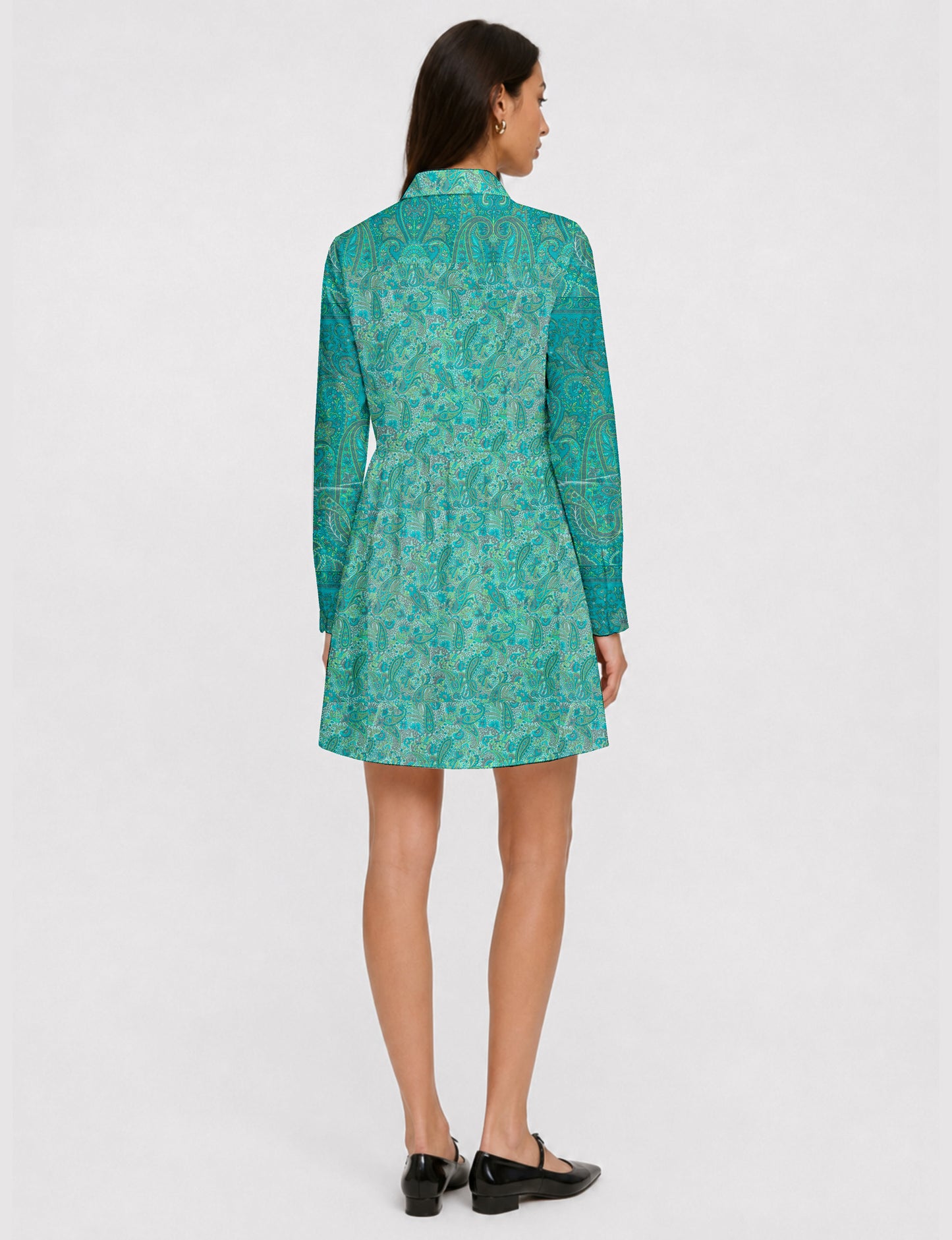 Short shirt dress with a relaxed A-line silhouette, point collar, partial button placket, gathered waist, side pockets, and full-length cuffed sleeves.