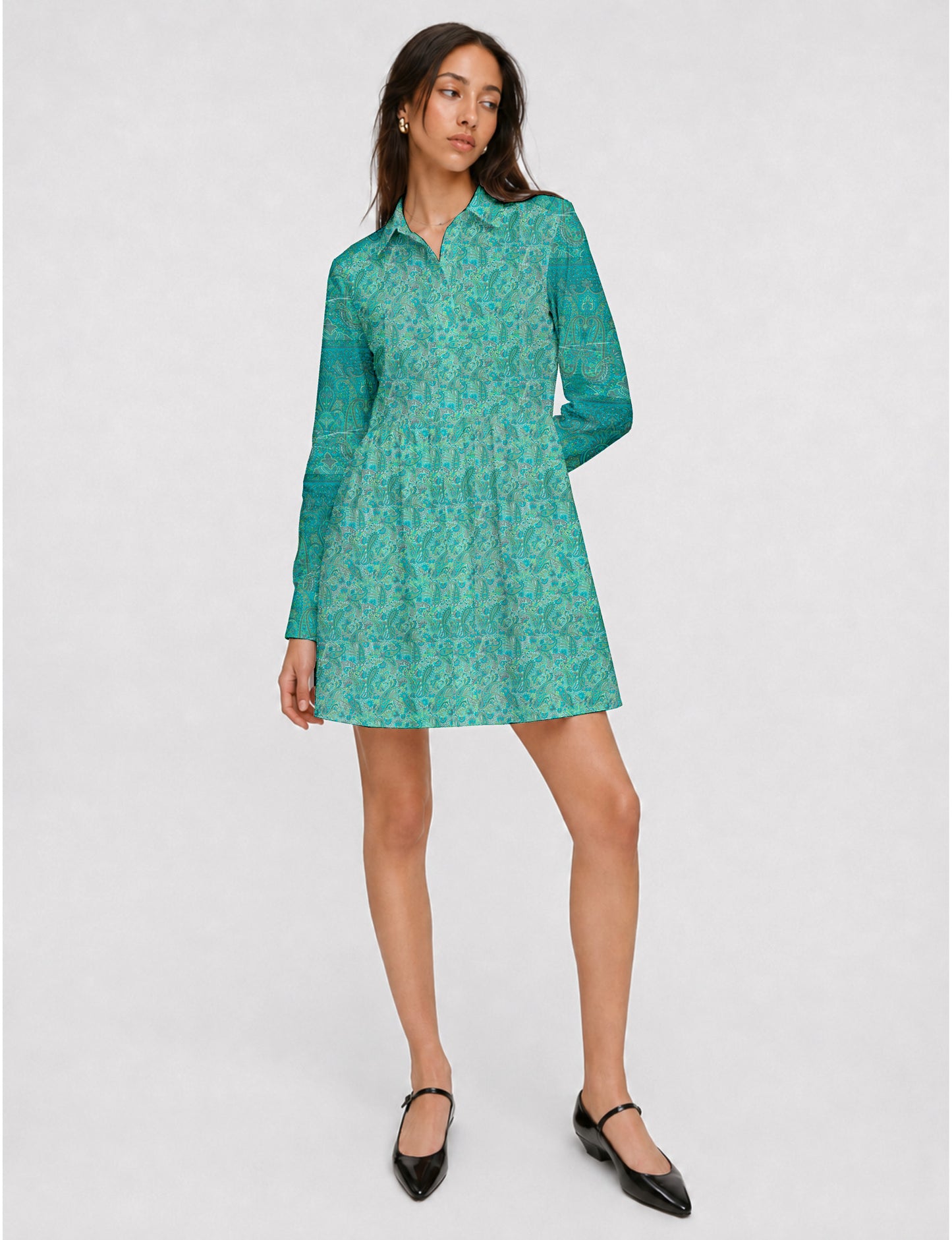 Short shirt dress with a relaxed A-line silhouette, point collar, partial button placket, gathered waist, side pockets, and full-length cuffed sleeves.