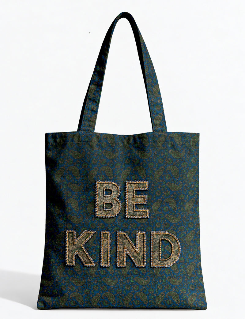 Be Kind tote bag with contrast sari fabric appliqué lettering, double shoulder straps, and front slip pocket.