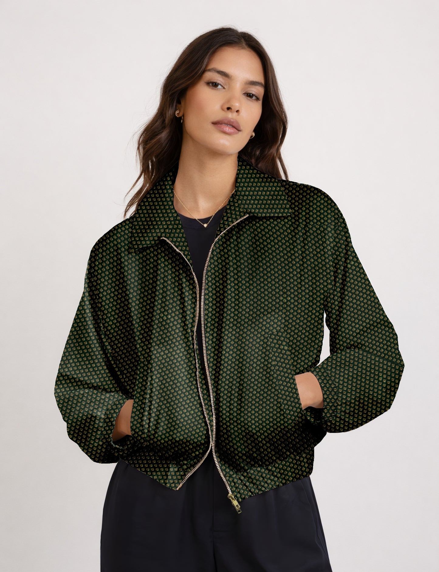 Women's cropped bomber jacket with twin metallic front zippers, welt pockets, elasticated hem and cuffs, and contrast sari print lining.