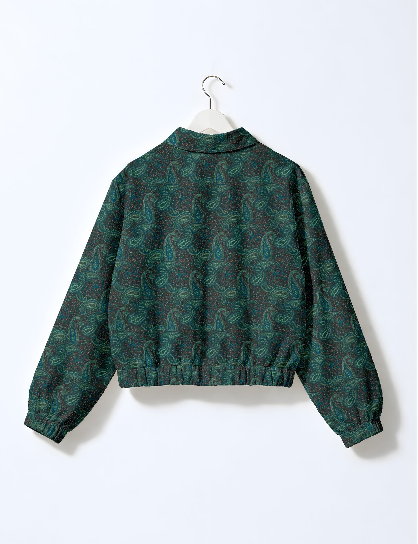 Women's cropped bomber jacket with twin metallic front zippers, welt pockets, elasticated hem and cuffs, and contrast sari print lining.