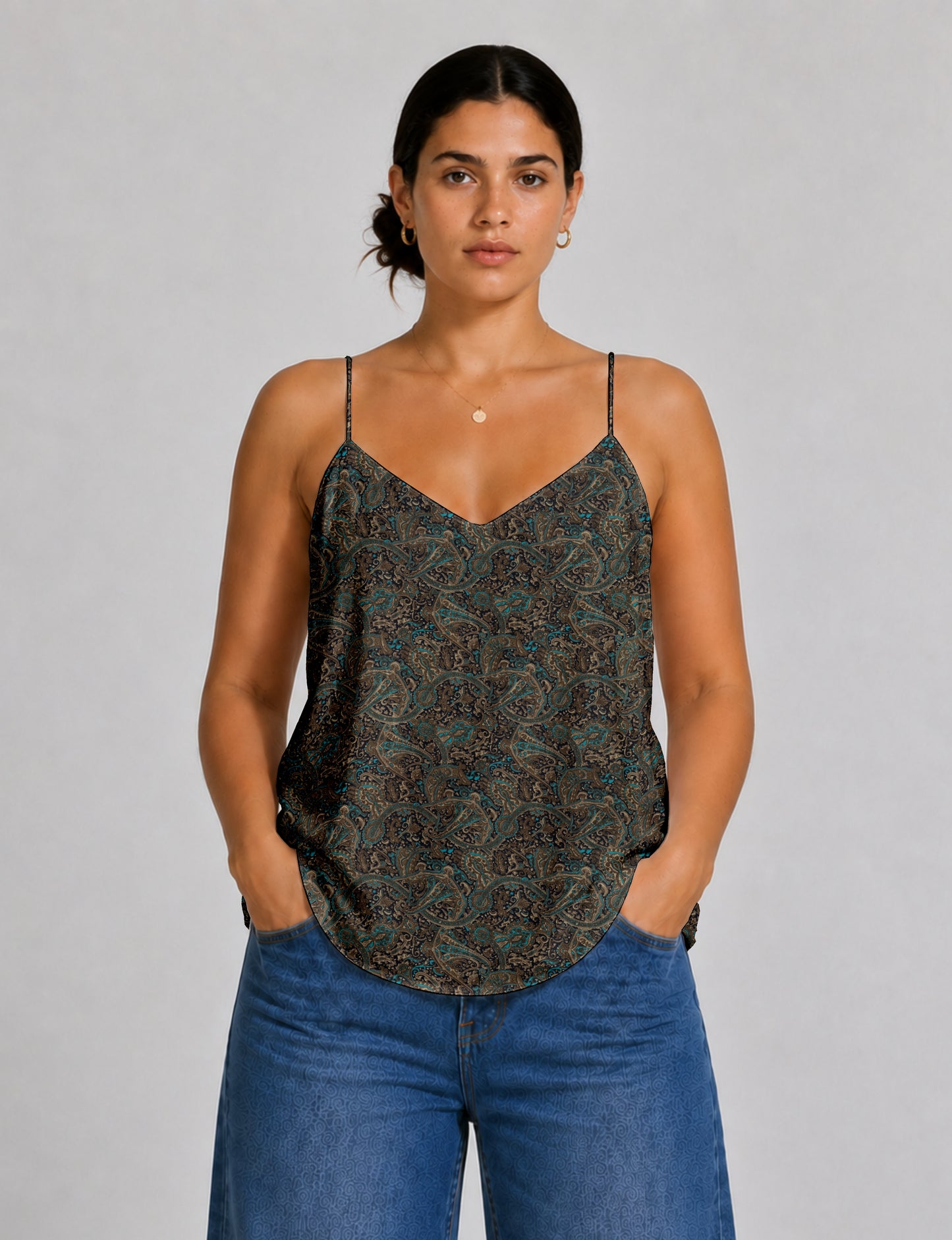Women's sleeveless slip top with a relaxed straight fit, soft V-neckline, deep V-back, and delicate spaghetti straps.