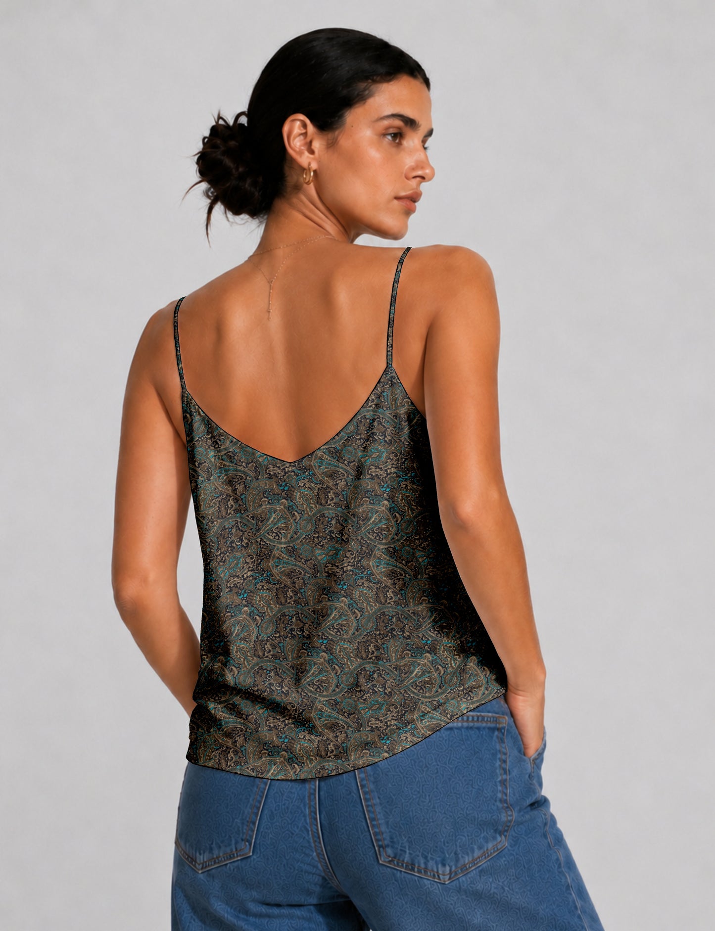 Women's sleeveless slip top with a relaxed straight fit, soft V-neckline, deep V-back, and delicate spaghetti straps.