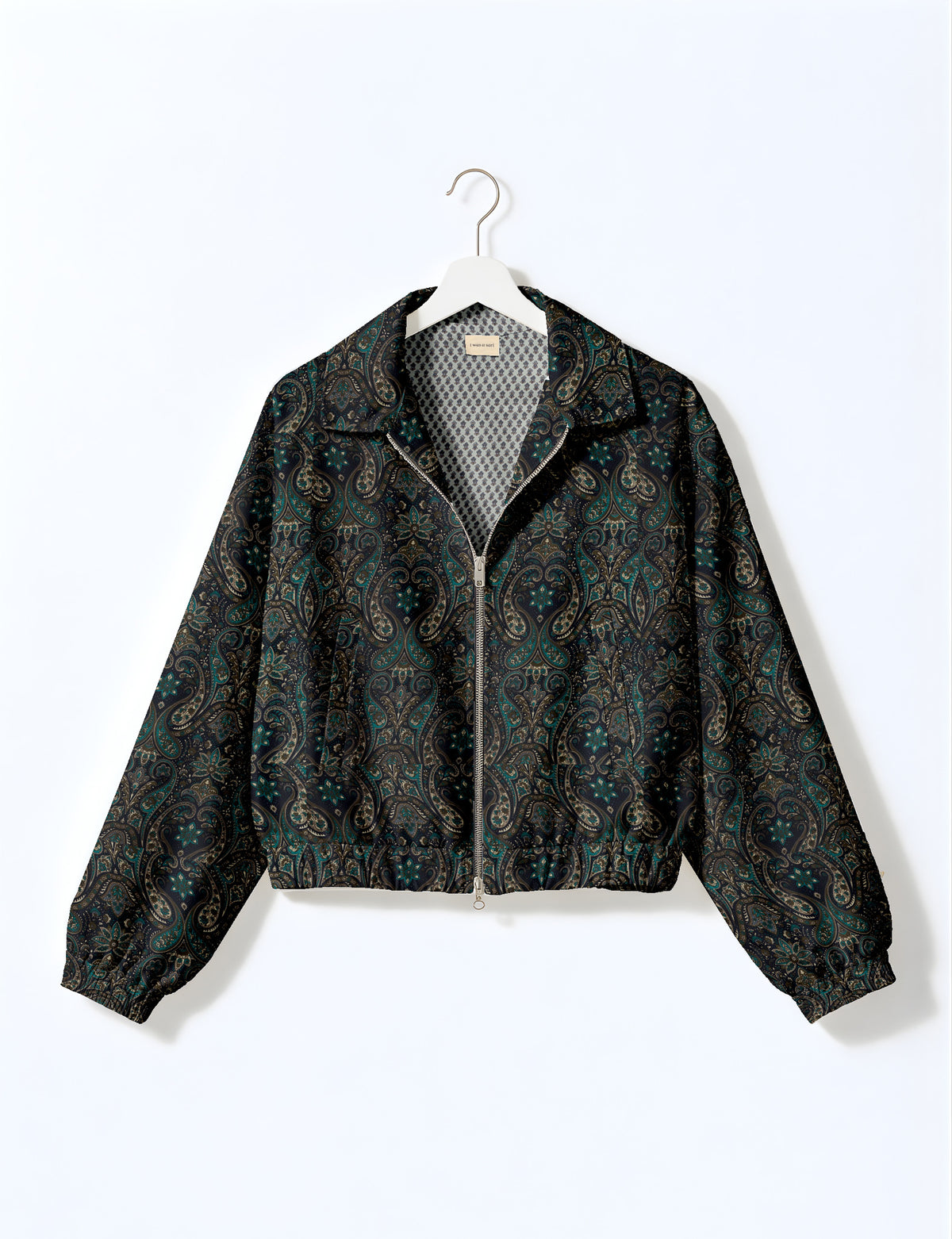Woman wearing a yellow floral bomber jacket with front zipper, elastic cuffs, and side pockets, shown from front view