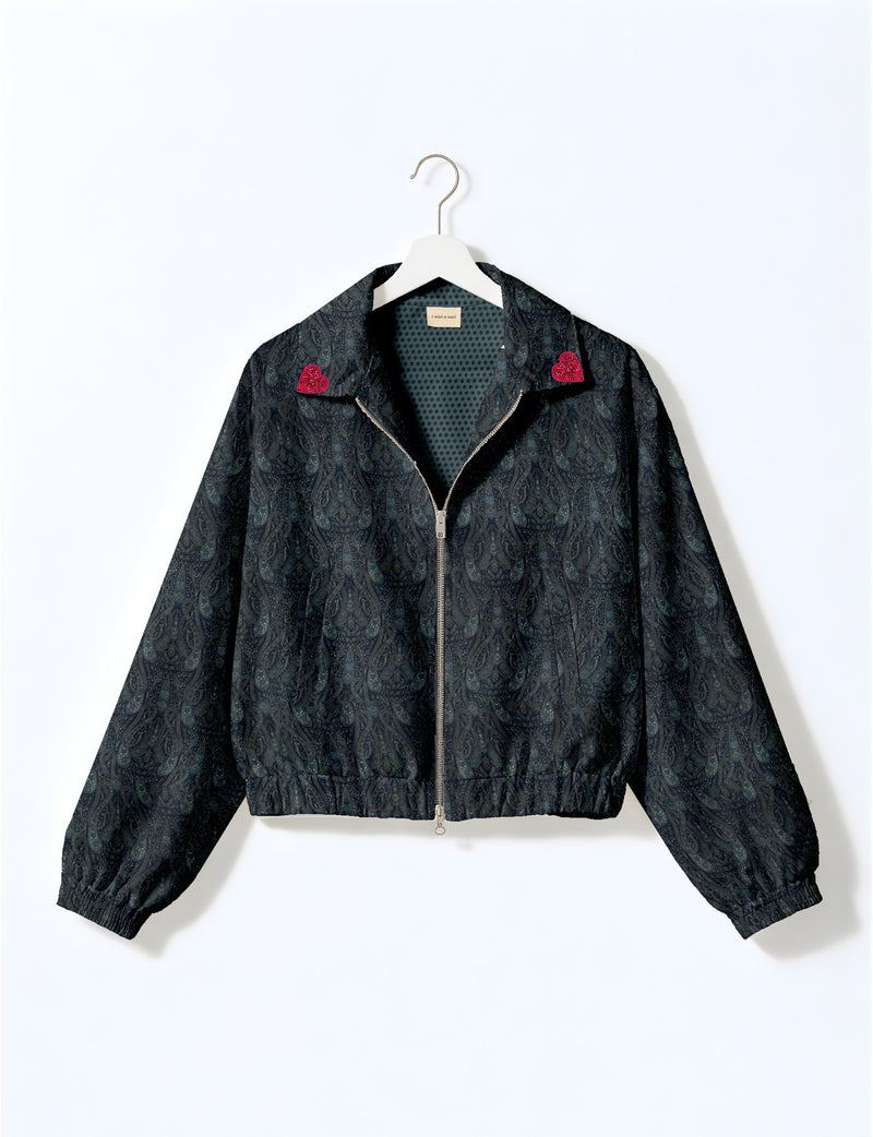 Love Bomber Jacket made from recycled fabric, featuring hand-stitched Aari embroidery. A unique piece of zero-waste clothing, part of the circular fashion movement. Designed with upcycled materials for a stylish yet environmentally friendly clothing choice.