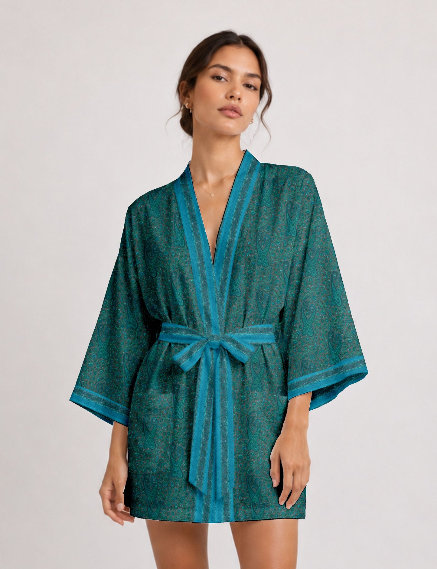 Short kimono robe with wrap front, V-neckline, wide sleeves, waist tie, and concealed skort detail.