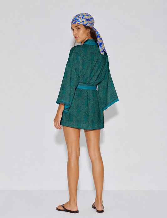 Short kimono robe with wrap front, V-neckline, wide sleeves, waist tie, and concealed skort detail.