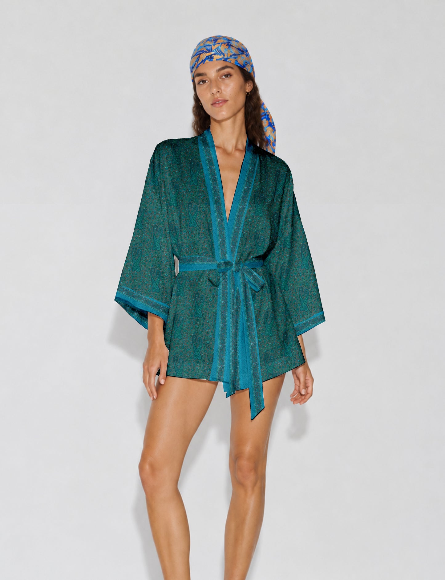 Short kimono robe with wrap front, V-neckline, wide sleeves, waist tie, and concealed skort detail.
