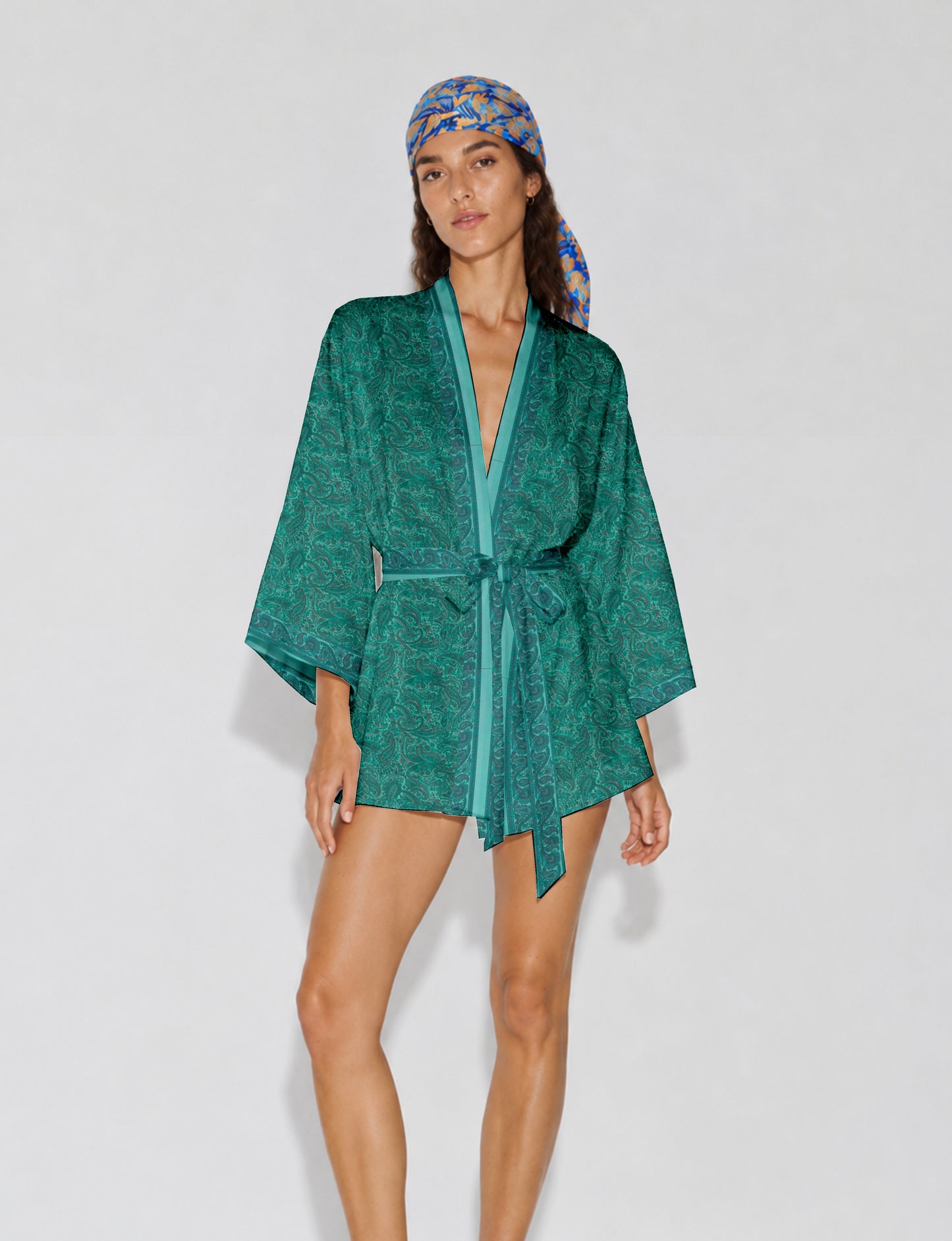 Short kimono robe with wrap front, V-neckline, wide sleeves, waist tie, and concealed skort detail.