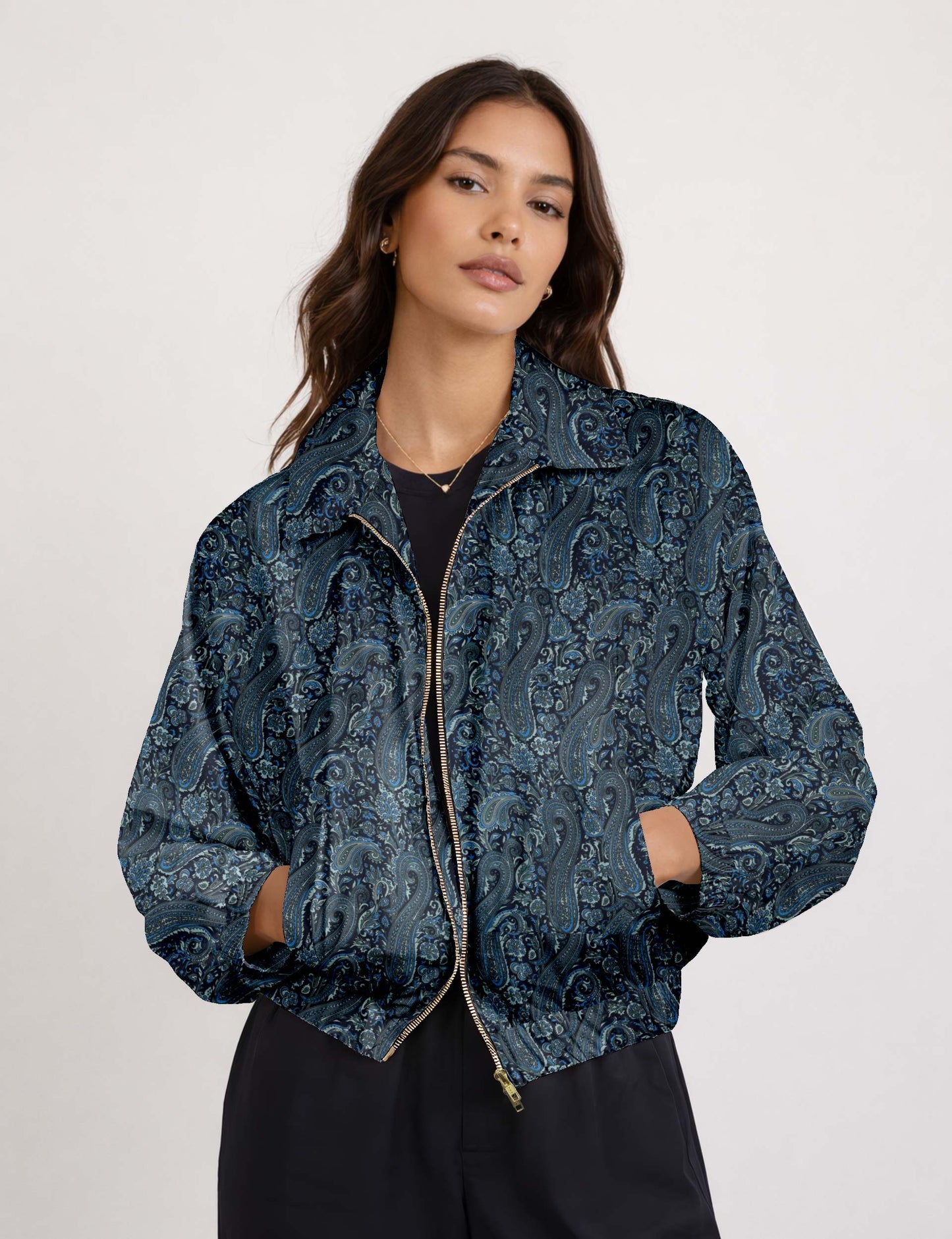 Brown floral bomber jacket with front zipper, elastic cuffs and hem, hanging on white hanger, red floral inner lining visible