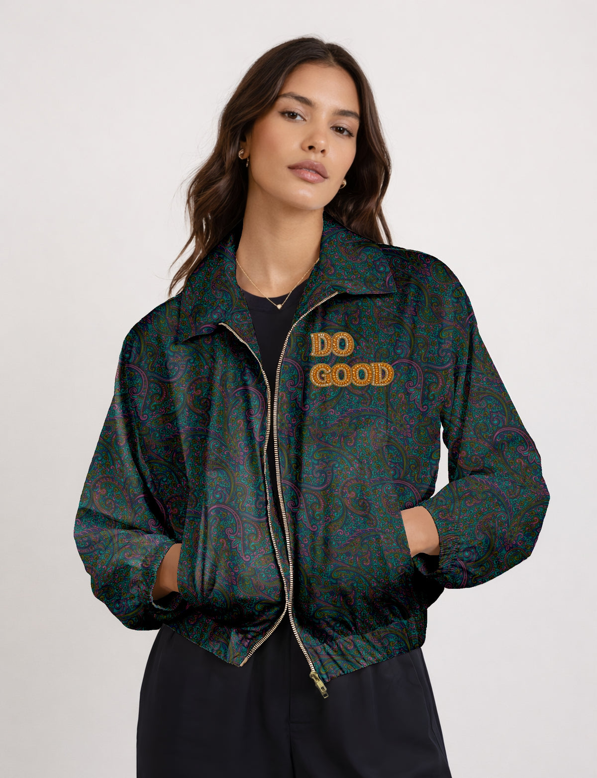 Gold cropped DO GOOD bomber jacket featuring hand-embroidered lettering on the left chest, contrasting inner lining and two functional pockets.