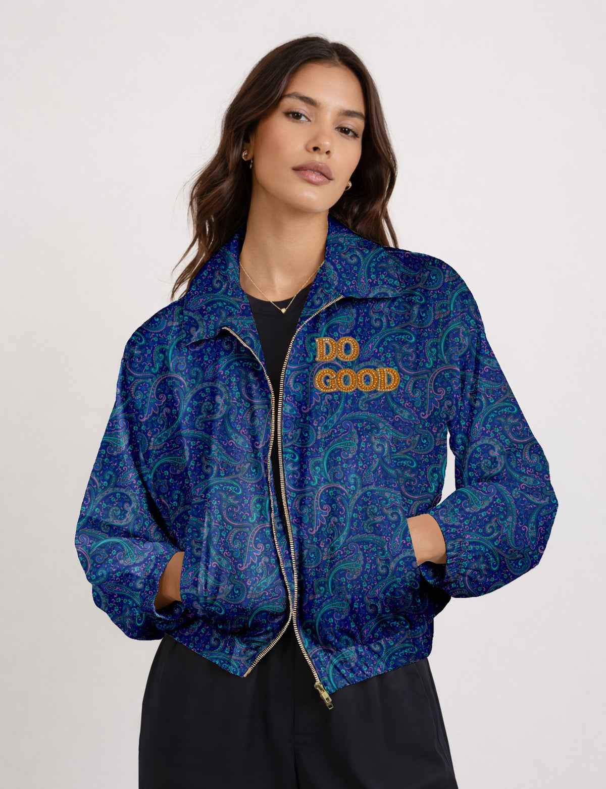 Gold cropped DO GOOD bomber jacket featuring hand-embroidered lettering on the left chest, contrasting inner lining and two functional pockets.