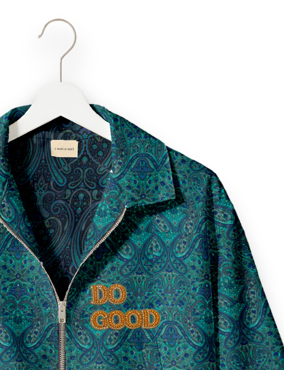 Gold cropped DO GOOD bomber jacket featuring hand-embroidered lettering on the left chest, contrasting inner lining and two functional pockets.