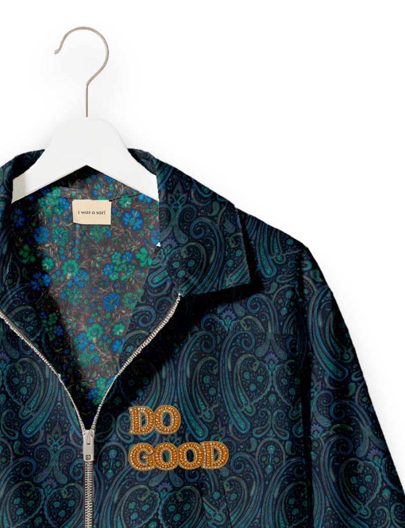 Gold cropped DO GOOD bomber jacket featuring hand-embroidered lettering on the left chest, contrasting inner lining and two functional pockets.