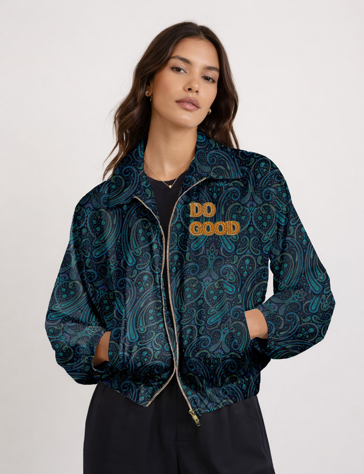 Gold cropped DO GOOD bomber jacket featuring hand-embroidered lettering on the left chest, contrasting inner lining and two functional pockets.