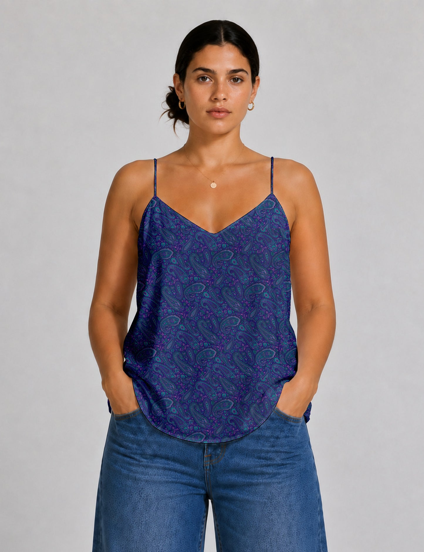 Women's sleeveless slip top with a relaxed straight fit, soft V-neckline, deep V-back, and delicate spaghetti straps.