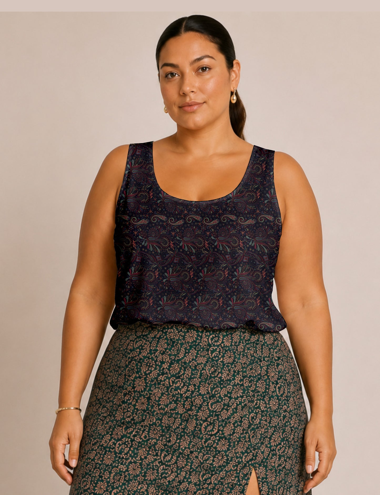 Women's sleeveless blouse with a relaxed straight fit, wide scoop neckline, deep scoop back, and hip-length silhouette.