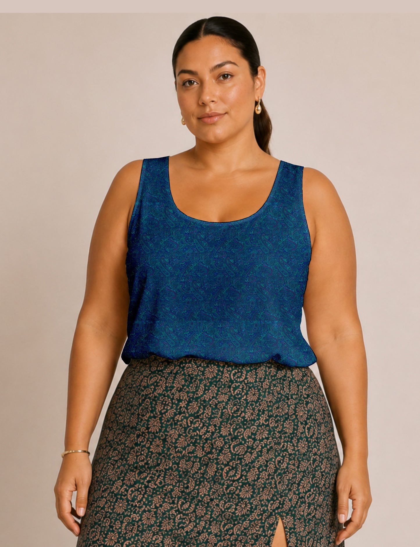 Women's sleeveless blouse with a relaxed straight fit, wide scoop neckline, deep scoop back, and hip-length silhouette.