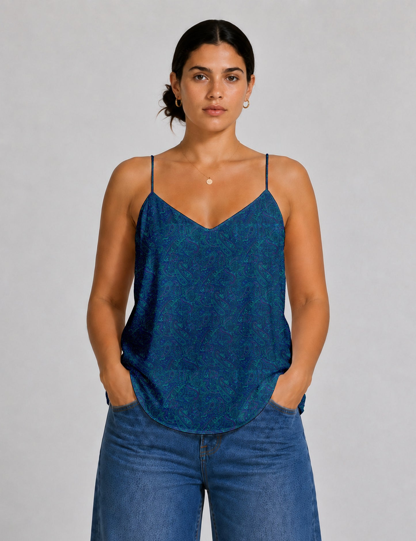 Women's sleeveless slip top with a relaxed straight fit, soft V-neckline, deep V-back, and delicate spaghetti straps.