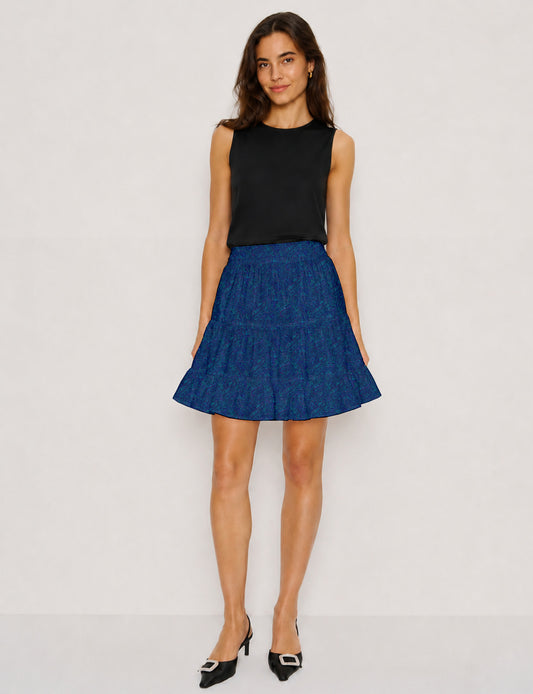 Short tiered skirt with a fitted waistband, knife pleats, softly flared silhouette, side seam pockets, and above-the-knee length.