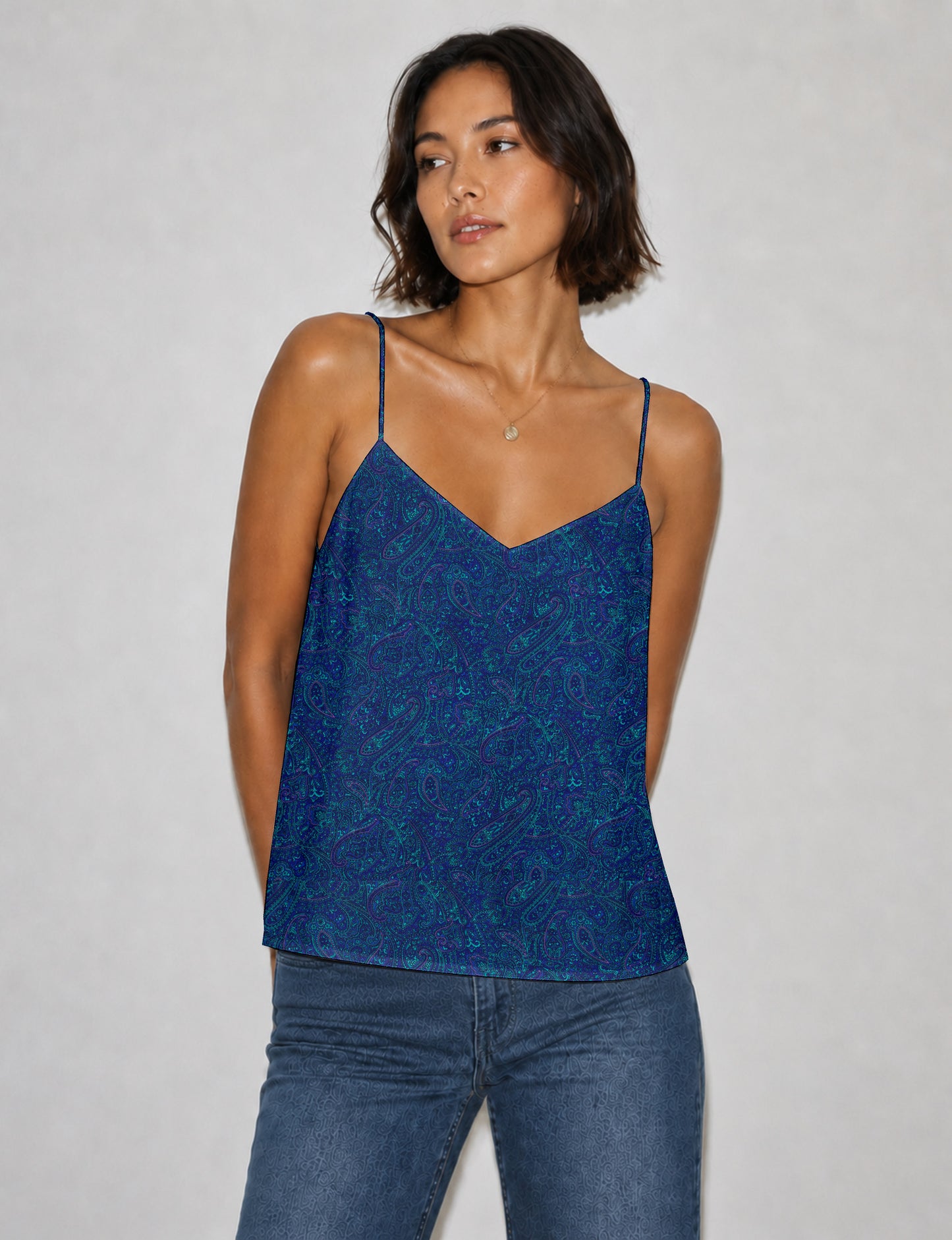 Women's sleeveless slip top with a relaxed straight fit, soft V-neckline, deep V-back, and delicate spaghetti straps.